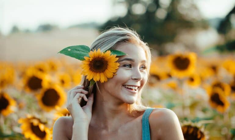woman with sunflower in hair